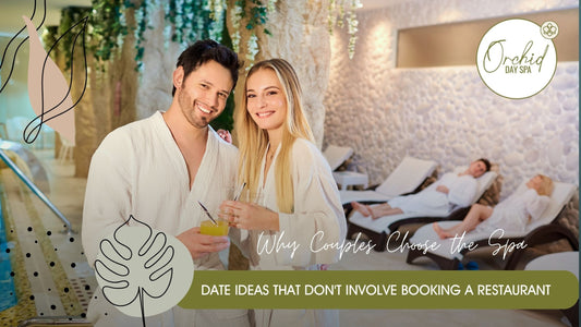 Smiling couple in spa robes enjoying refreshments in a serene relaxation lounge, showcasing the indulgent and relaxing experience of couples spa packages at Orchid Day Spa