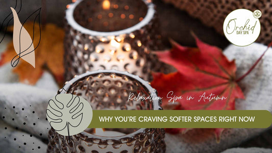 Candlelit relaxation spa setting with autumn leaves and warm tones, creating a calming and cosy wellness atmosphere at Orchid Day Spa.